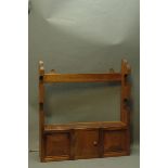 Wall mounting gun rack with cupboard. Height 56 cm, width 51 cm.