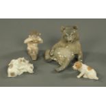 Four Royal Copenhagen figures, bear, pigs, fawn and puppy. Tallest 15 cm.