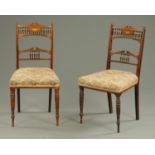 A pair of Edwardian inlaid rosewood occasional chairs, with stuffover seats and turned front legs.