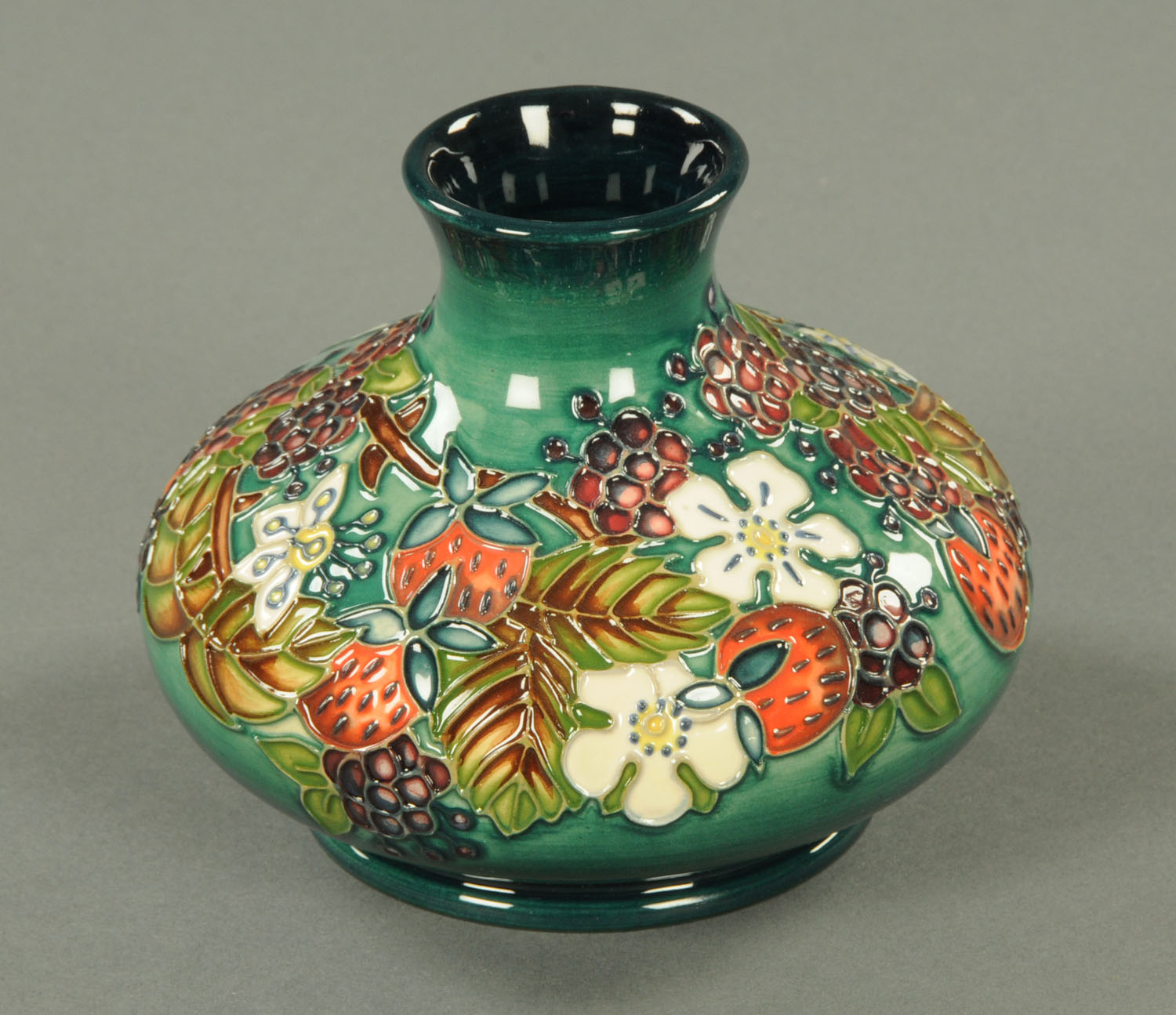 A Moorcroft squat vase, 1996, "Carousel". Height 11 cm.