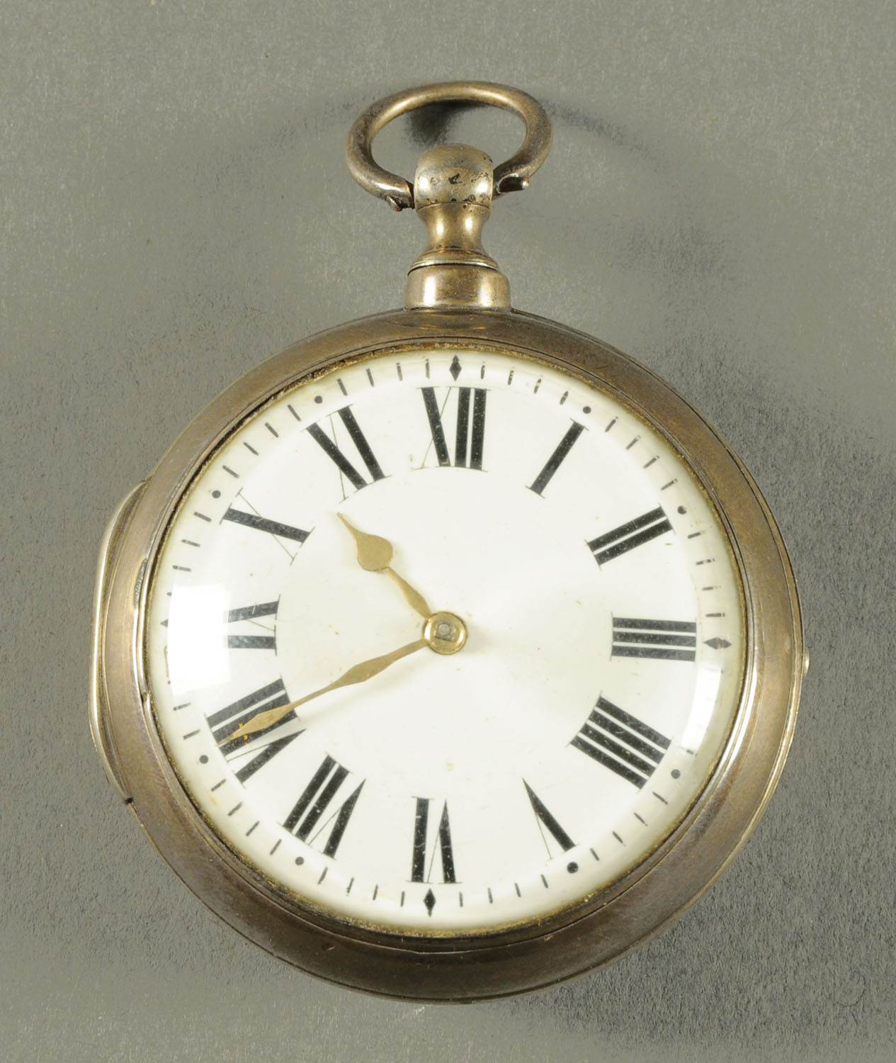 A large English silver pair cased verge pocket watch, the case dated 1814 London.