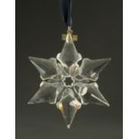 A Swarovski crystal Christmas star, 2000. Width 7.5 cm, cased.