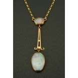 A Victorian 9 ct gold opal pendant with necklace.