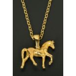 A 9 ct gold horse pendant, with 9 ct gold chain, 26.6 grams (see illustration).