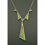 A French Art Deco platinon and green glass necklace, circa 1925.