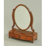 A 19th century mahogany toilet mirror, oval, fitted with two base drawers. Width 42 cm.