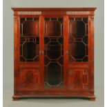 A late Victorian mahogany gun cabinet, converted to a display case,