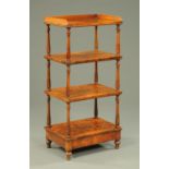 A Victorian walnut four tier whatnot stand, raised on short turned legs. Width 61 cm.