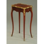 An early 20th century French occasional table, shaped outline,