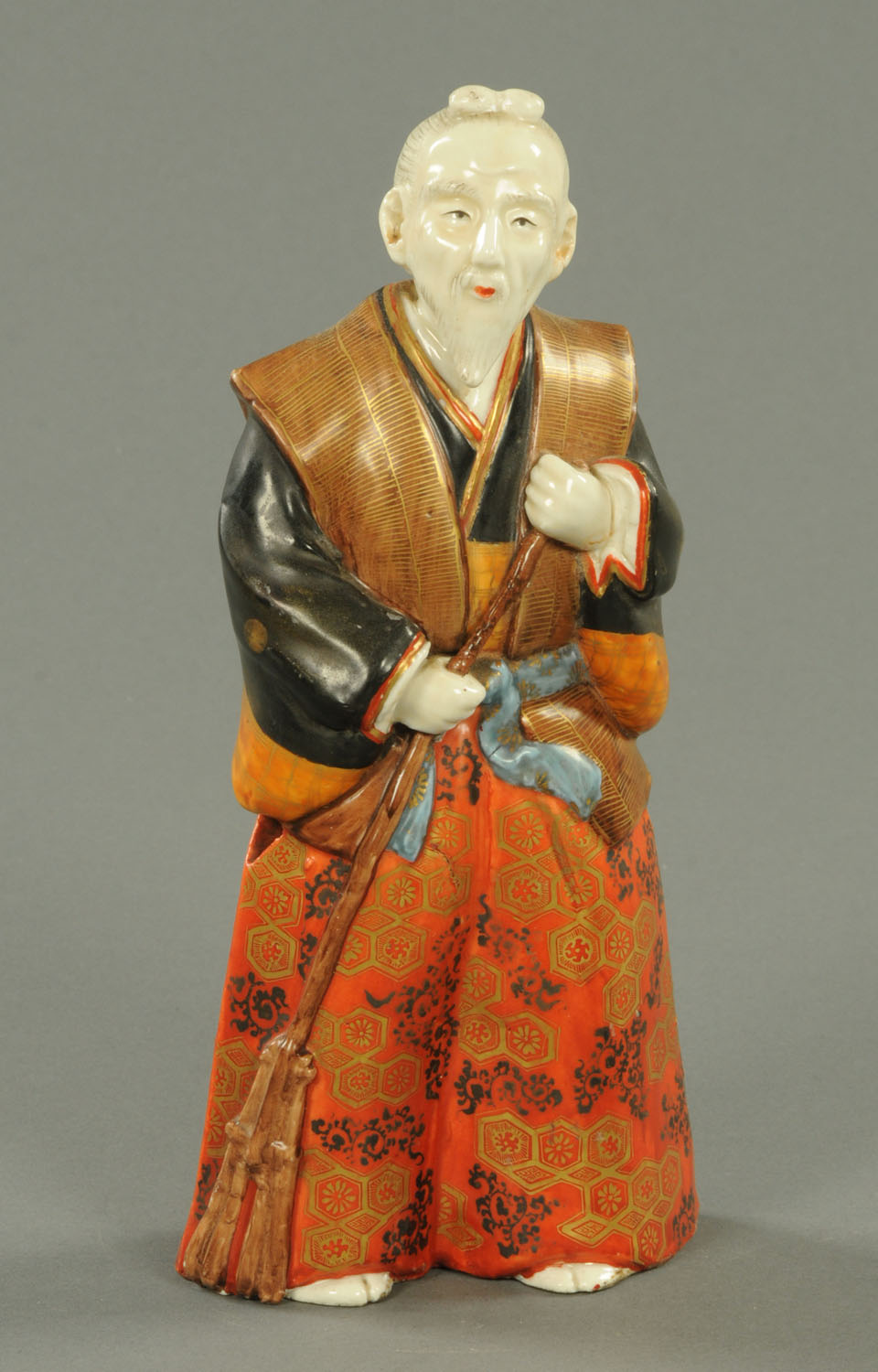 A 19th century Chinese Fu Lo Shou porcelain figure. Height 26 cm (see illustration).