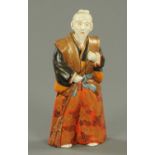 A 19th century Chinese Fu Lo Shou porcelain figure. Height 26 cm (see illustration).