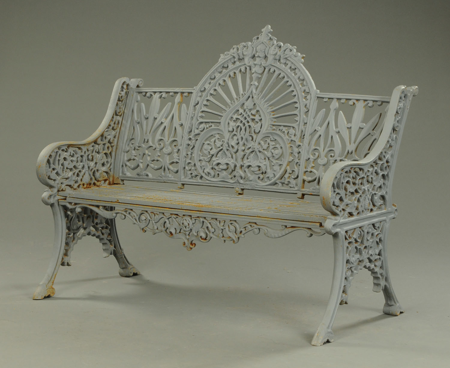 A Victorian style cast iron garden bench. Width 118 cm (see illustration).