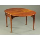 A George III mahogany drop leaf dining table.