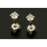 A pair of 18 ct white gold stud earrings, total diamond weight +/- .38 carats.