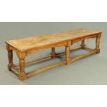 A large 18th century style reproduction oak refectory table, with rectangular three plank top,