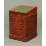 A Regency mahogany Davenport, with sliding top, fitted interior,