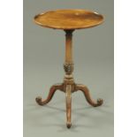 A George III mahogany tripod table, with circular dished top with snap action,