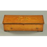 A Victorian inlaid rosewood cased music box, with 38 cm comb, playing ten airs. Case width 63 cm.