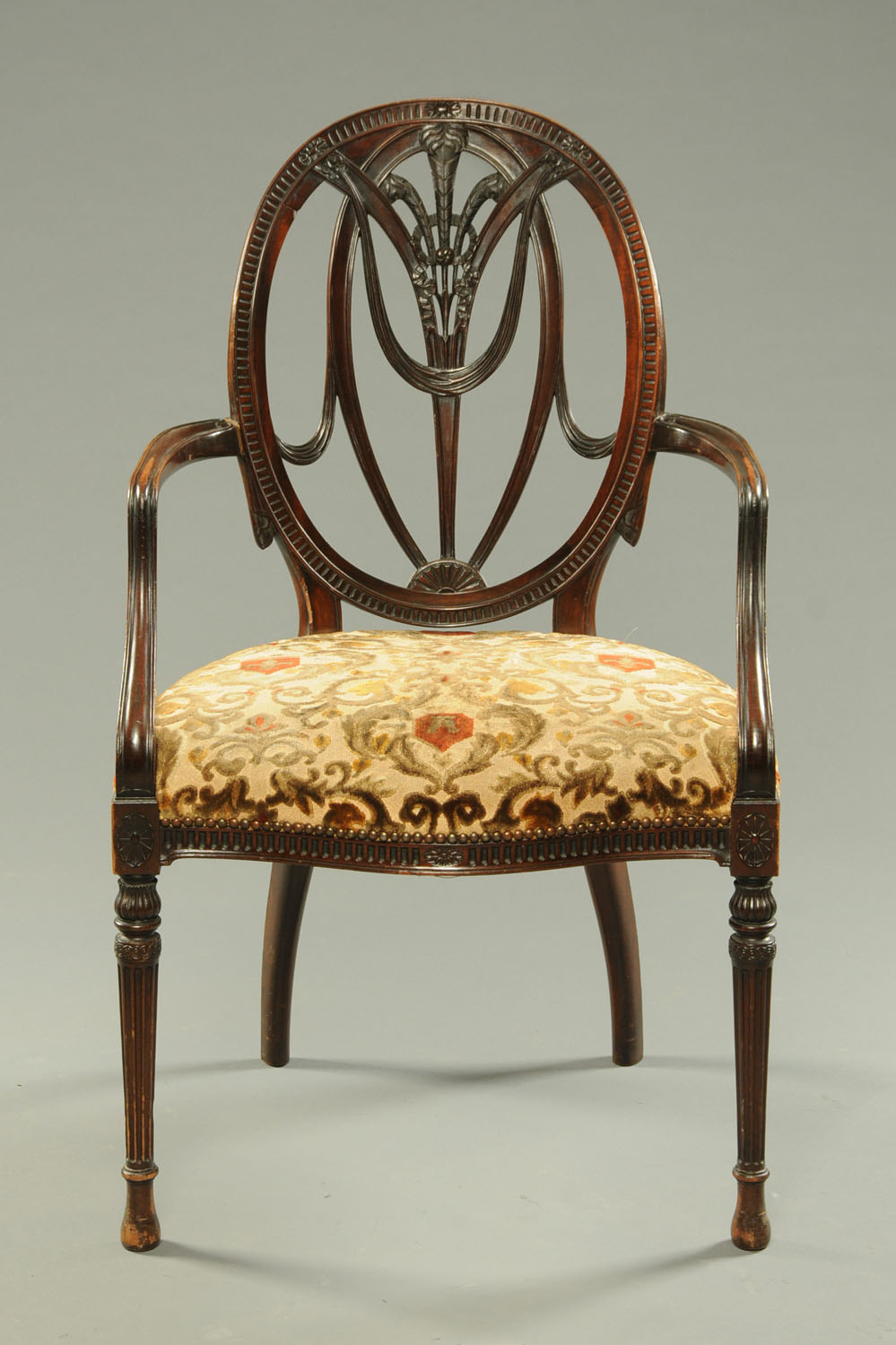 A Hepplewhite style mahogany occasional chair.