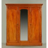 A Victorian mahogany wardrobe, with detachable cornice above three drawers enclosing trays,