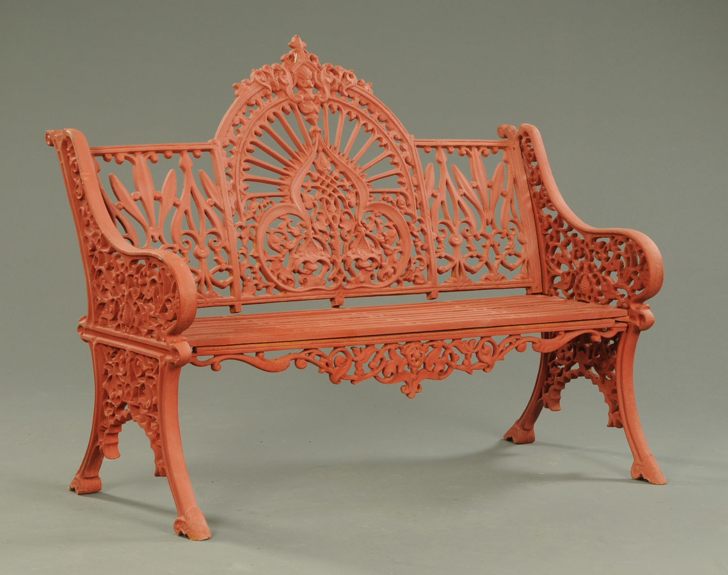 A Victorian style cast iron garden bench. Width 118 cm (see illustration).