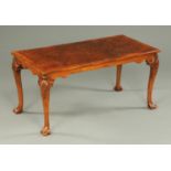 A walnut veneered coffee table, in the Queen Anne style,