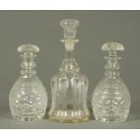 A pair of cut glass decanters, and a Victorian moulded glass decanter.