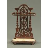 A Victorian cast iron hall stick stand, with drip tray. Height 50 cm.