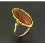 A Scottish George III polished red agate cabochon and gold ring.