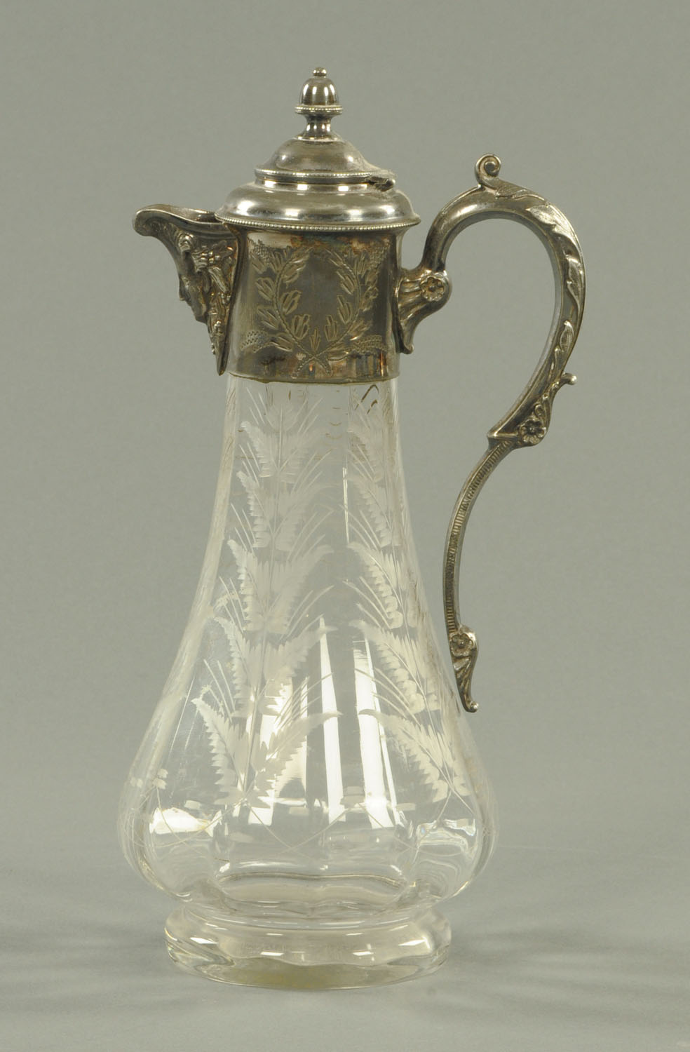 A 19th century cut glass French claret jug, with silver plated mounts.