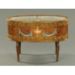 A Continental painted and gilt oval plant trough,