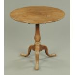 A George III mahogany tripod table, with single piece top,