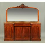 A Victorian mahogany sideboard, four door, with mirror back and raised on a plinth base.