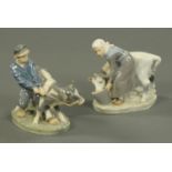 A pair of Royal Copenhagen figurines, young boy and girl each with calf. Height 17.