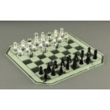 A Swarovski crystal chess set, complete with chessboard and case, boxed.