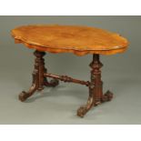 A Victorian walnut centre table, shaped outline, well figured, turned end supports,