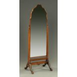 A walnut framed shaped cheval mirror,