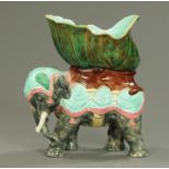 A 19th century Majolica elephant supporting a bowl, polychrome. Height 40 cm.