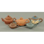 A group of five Chinese Yixing teapots. Largest length 15.5 cm.