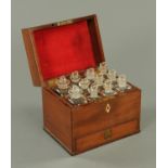 A George III mahogany apothecary chest, fitted with a series of jars and with drawer to base.