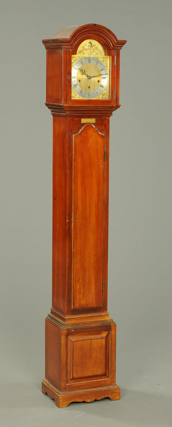 A mahogany grandmother clock, circa 1931, with three-train movement. Height 170 cm.