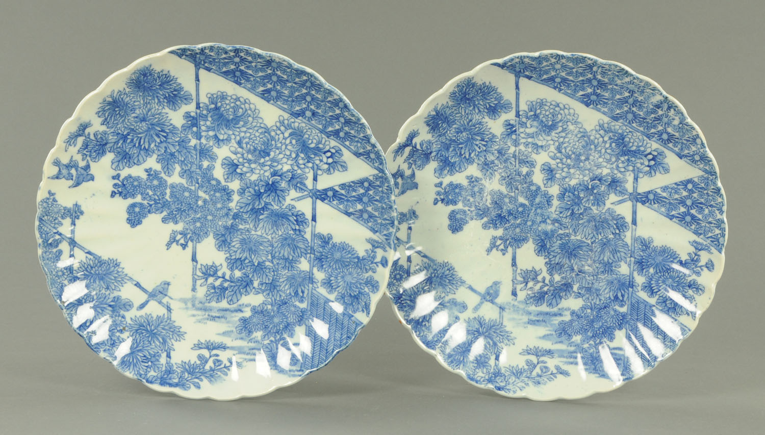 A pair of 19th century Japanese blue and white Arita chargers. Diameter 32 cm.