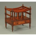 An early 19th century mahogany Canterbury, three divisions, with turned columns,