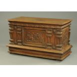 A large 19th century carved oak coffer,