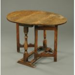 An 18th century oak gate leg table, twin drop flap. Width 81 cm, length open 97 cm.