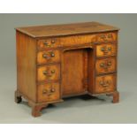 A George III style mahogany kneehole desk,