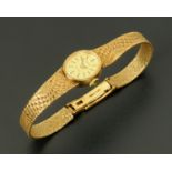 A ladies Tissot 9 ct gold cased wristwatch, Tissot Saphir, with gold bracelet and clasp, 18.