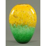 A Monart green and yellow mottled glass vase, signed to base. Height 30 cm.