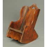 An early 19th century child's rocking chair, with commode seat. Width 37 cm.