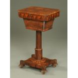 A Victorian rosewood worktable, with canted angles, faceted column, quatreform base and short feet.